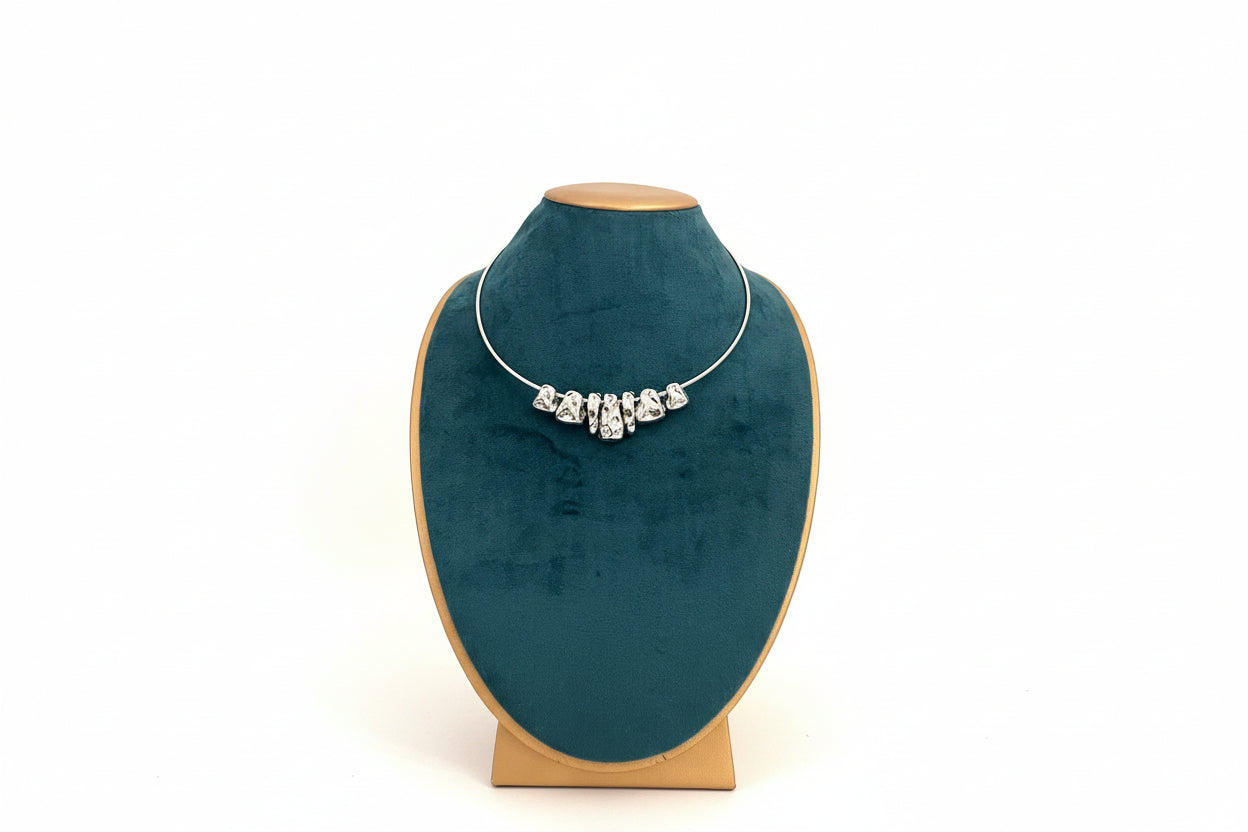 Silver necklace.