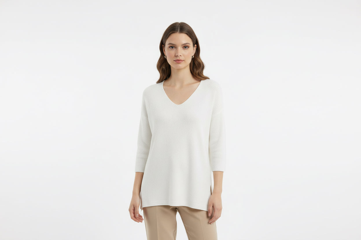Knitwear with elbow-length sleeves.