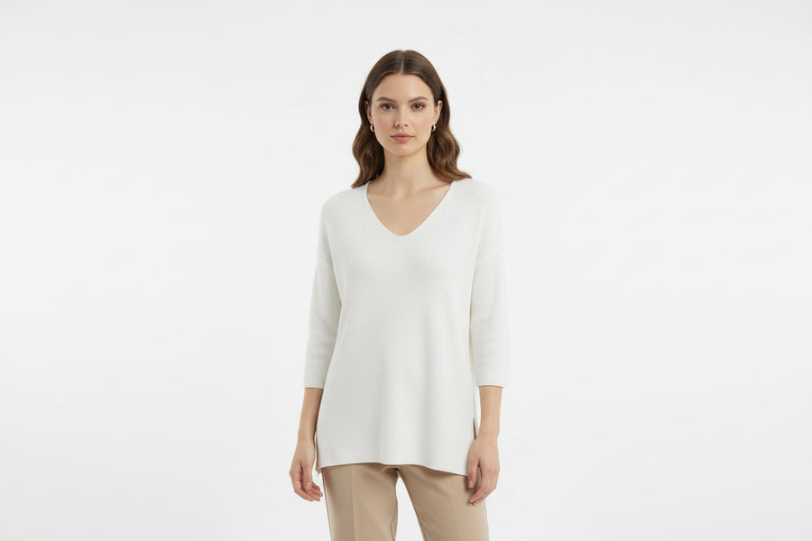 Knitwear with elbow-length sleeves.
