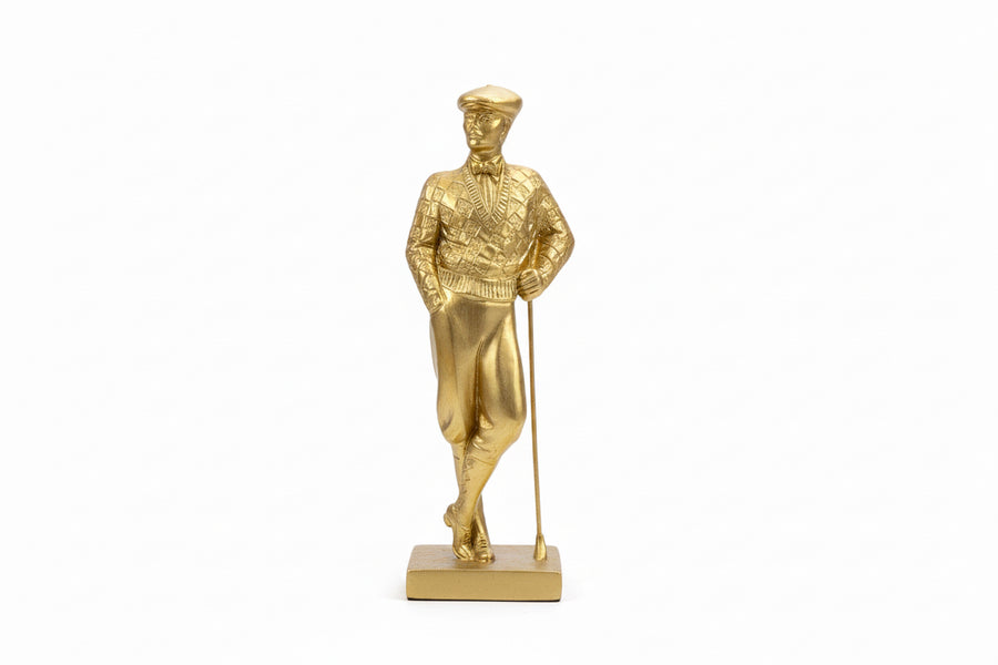 Golden male figure sculpture by Mikita